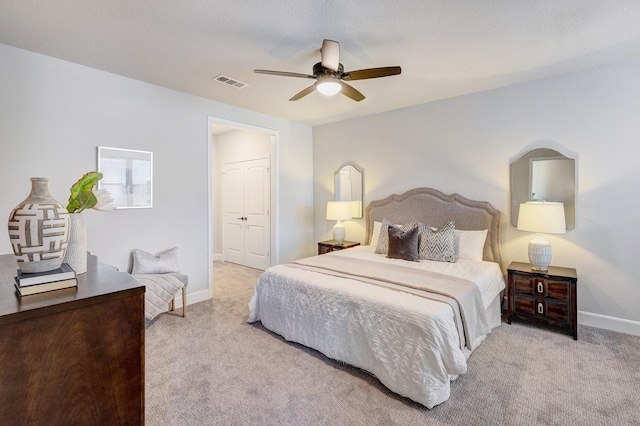 carpeted bedroom featuring ceiling fan