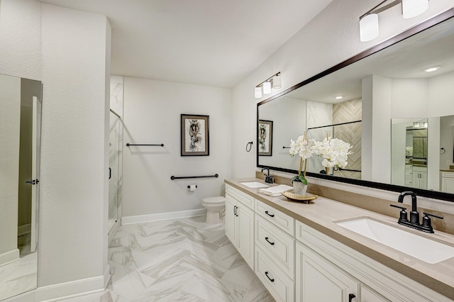 bathroom with vanity, toilet, and a shower