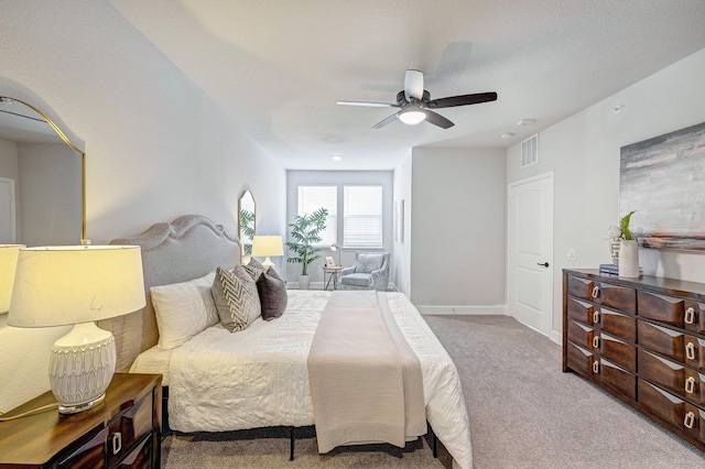 carpeted bedroom with ceiling fan