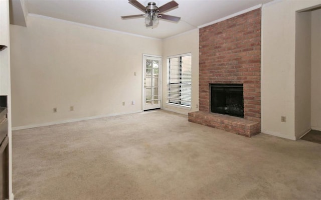 unfurnished living room featuring light carpet, a brick fireplace, ceiling fan, and ornamental molding