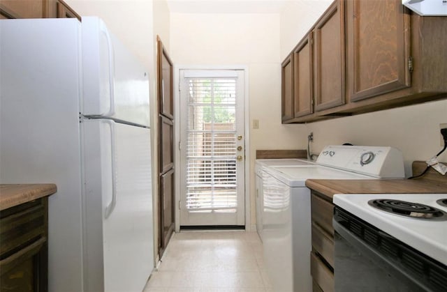 washroom with washer / dryer