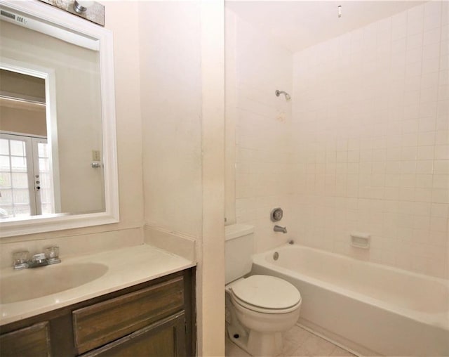 full bathroom featuring tile patterned flooring, vanity,  shower combination, and toilet