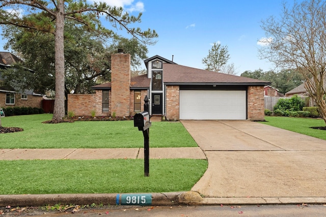 view of front of home featuring a front yard and a garage