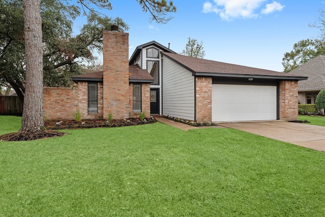 view of front of home with a garage and a front lawn