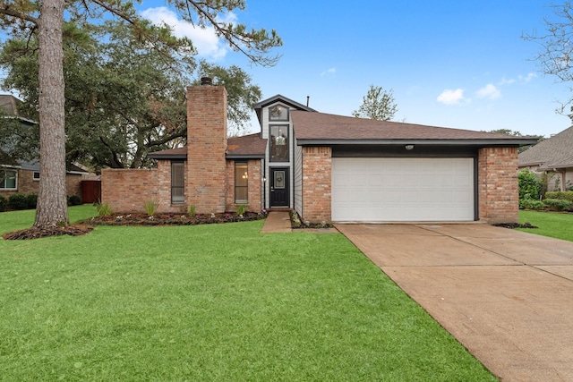 view of front of property featuring a front lawn and a garage