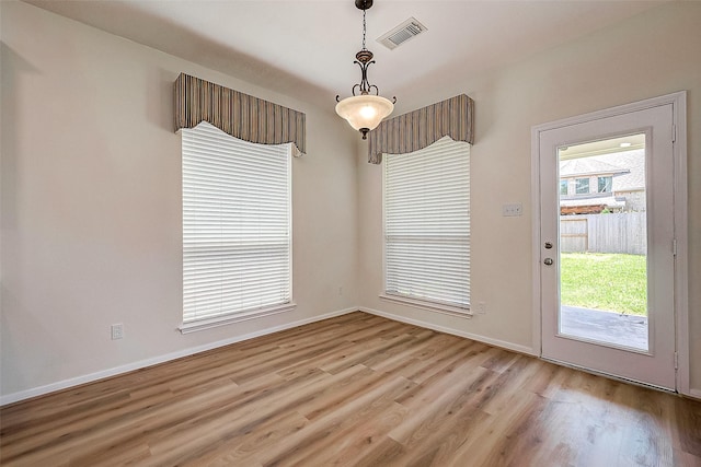 unfurnished dining area featuring light hardwood / wood-style flooring and a healthy amount of sunlight