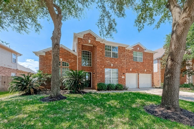 view of front of property featuring a garage and a front lawn