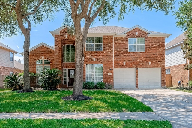 view of front of home with a front lawn and a garage