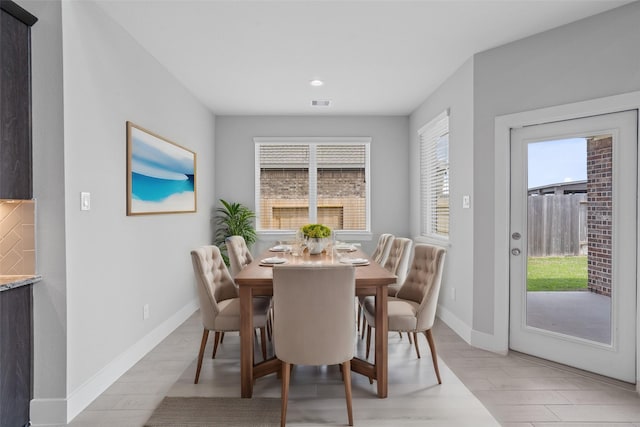 dining room with light wood-type flooring