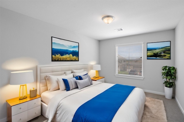 bedroom featuring light carpet