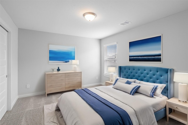 bedroom featuring light colored carpet