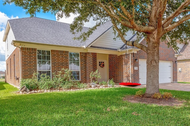 view of front facade with a front yard and a garage