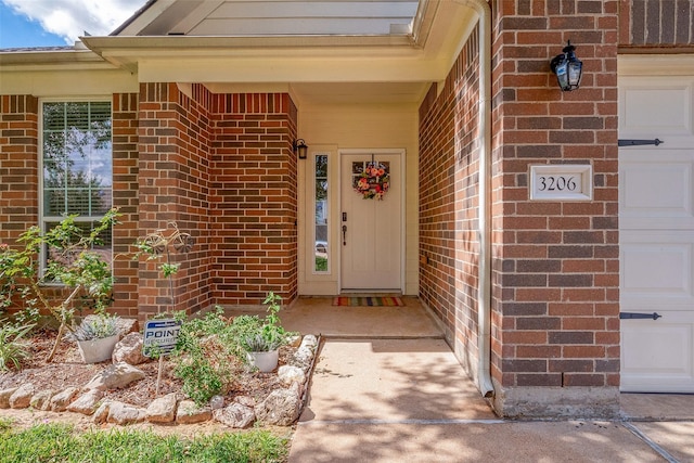 view of exterior entry featuring a garage