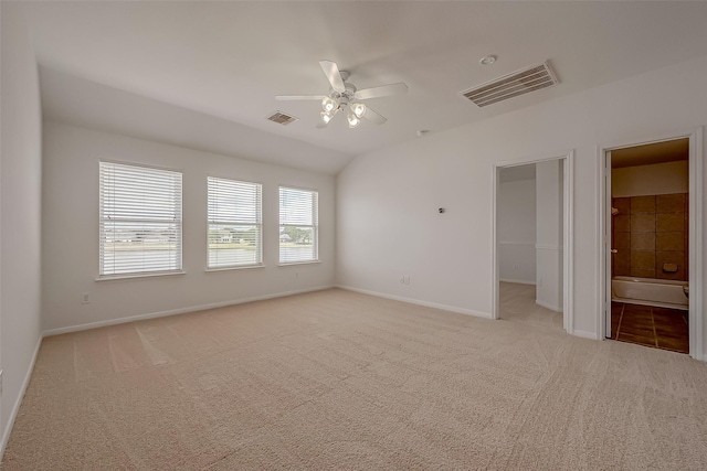 unfurnished room featuring ceiling fan, light carpet, and vaulted ceiling