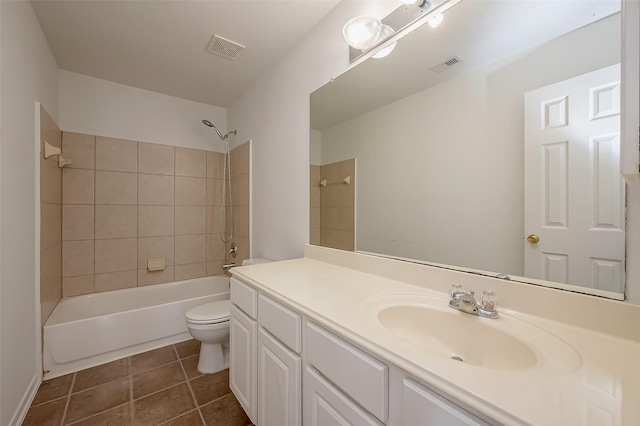 full bathroom featuring vanity, toilet, and tiled shower / bath