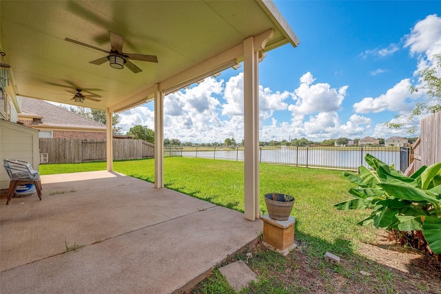 view of patio featuring ceiling fan and a water view