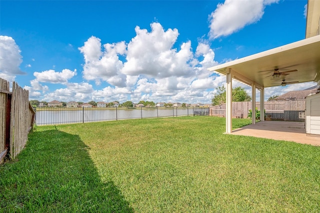 view of yard featuring ceiling fan and a patio area