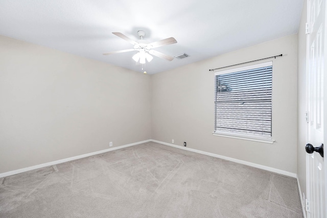 carpeted empty room with ceiling fan