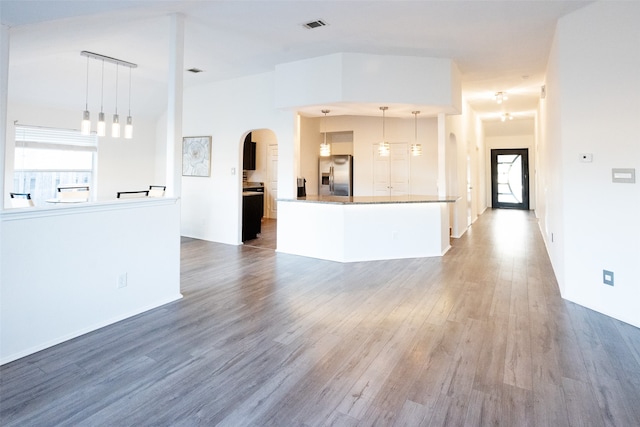 unfurnished living room with wood-type flooring