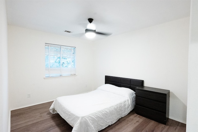 bedroom featuring ceiling fan and wood-type flooring