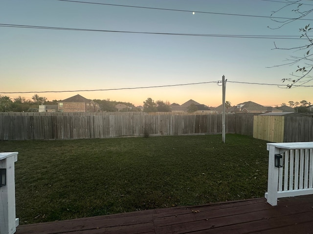 yard at dusk with a deck