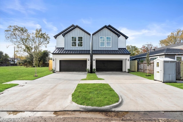 modern inspired farmhouse featuring a standing seam roof, a front lawn, a garage, and board and batten siding