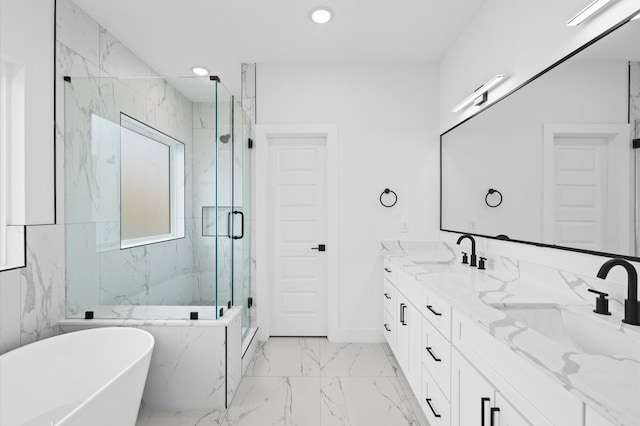 bathroom with vanity and independent shower and bath