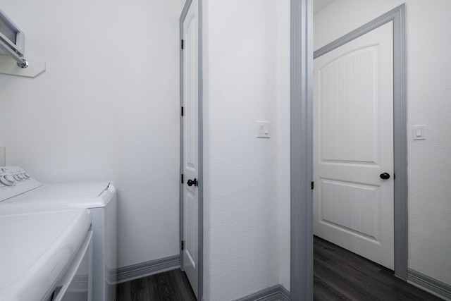 washroom featuring washer and clothes dryer and dark hardwood / wood-style floors