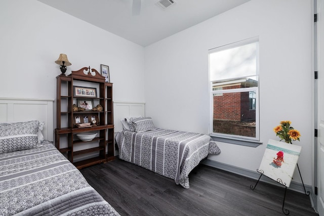 bedroom featuring ceiling fan and dark hardwood / wood-style floors