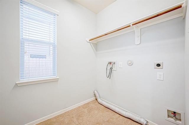 laundry room featuring gas dryer hookup, hookup for an electric dryer, hookup for a washing machine, and light tile patterned floors