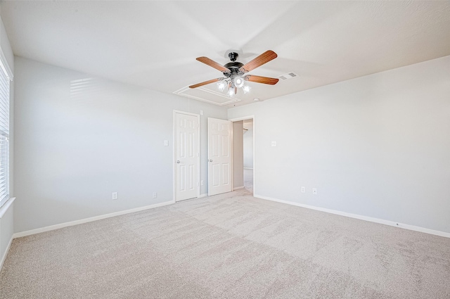 unfurnished bedroom with light colored carpet and ceiling fan