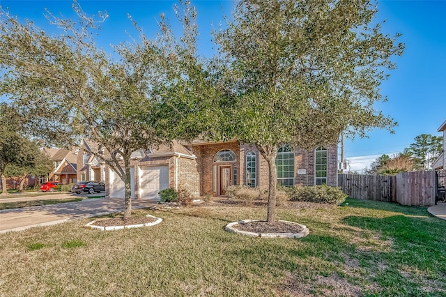 view of front of house with a garage and a front yard