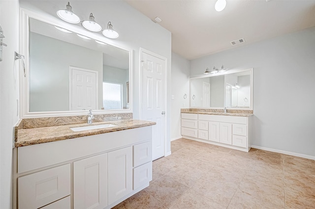 bathroom with vanity and tile patterned flooring