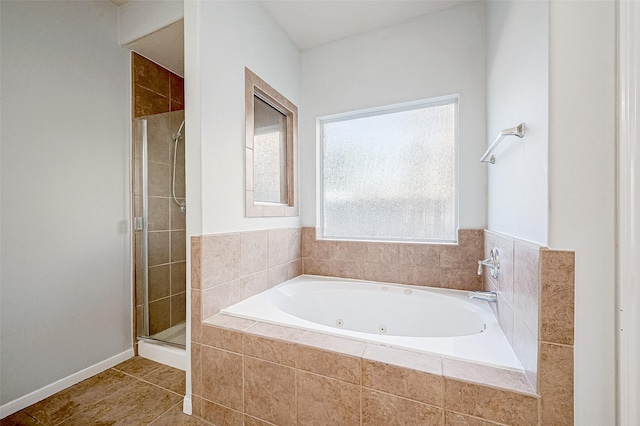 bathroom featuring separate shower and tub and tile patterned floors