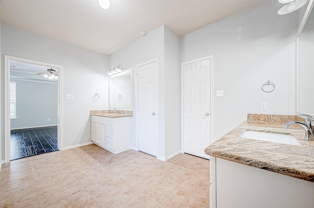 bathroom featuring vanity, tile patterned flooring, and ceiling fan