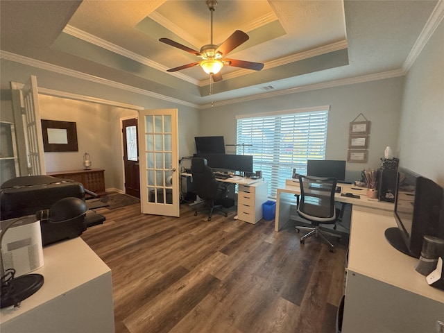 home office featuring a tray ceiling, french doors, dark hardwood / wood-style floors, and ornamental molding