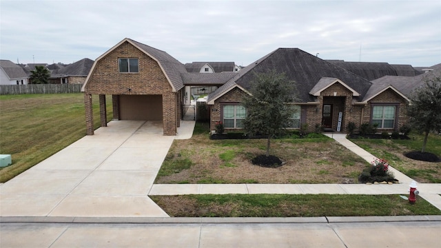 view of front of house with a garage and a front lawn