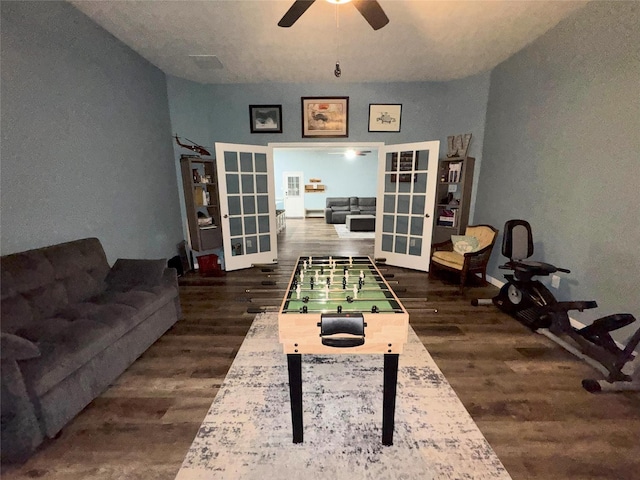 recreation room with french doors and dark wood-type flooring