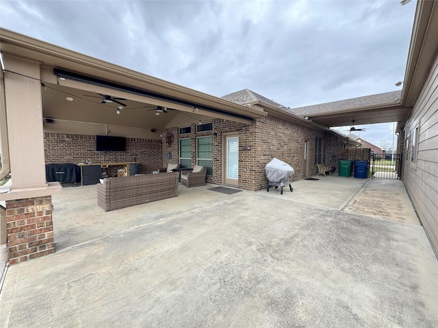 view of patio with outdoor lounge area, ceiling fan, and area for grilling