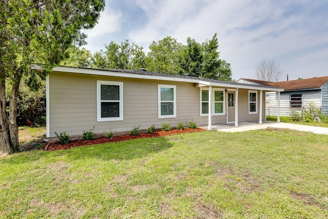 ranch-style home with a front lawn