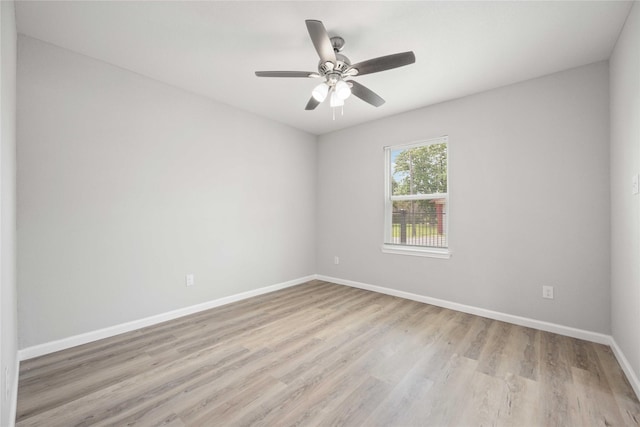 spare room featuring light hardwood / wood-style flooring and ceiling fan