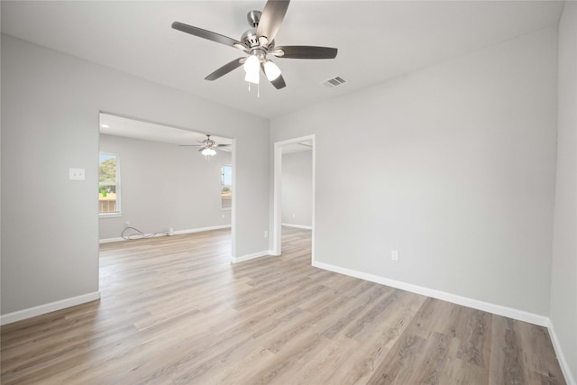 unfurnished room with ceiling fan and light hardwood / wood-style flooring