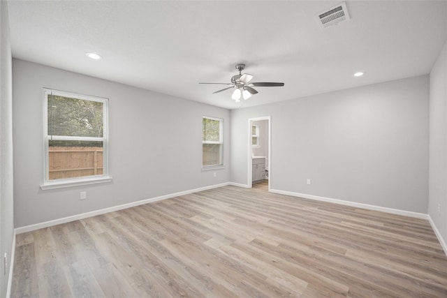 unfurnished room featuring light hardwood / wood-style flooring and ceiling fan