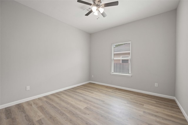 empty room with light wood-type flooring and ceiling fan