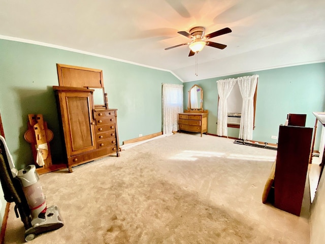 carpeted bedroom featuring ceiling fan, vaulted ceiling, and ornamental molding