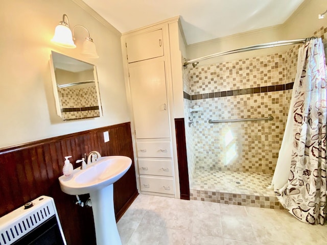 bathroom with a shower with shower curtain, ornamental molding, heating unit, and wooden walls