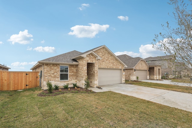 view of front of house with a garage and a front yard