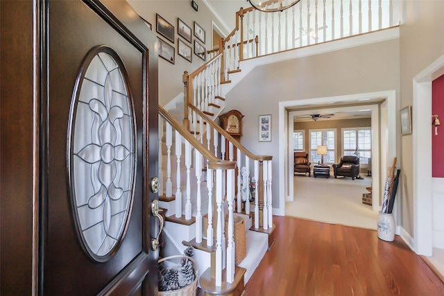 foyer featuring ceiling fan and hardwood / wood-style flooring