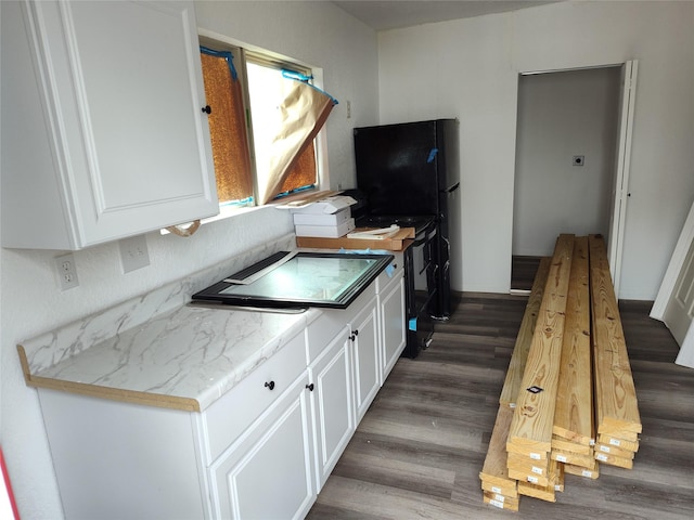 kitchen with white cabinets and dark hardwood / wood-style flooring