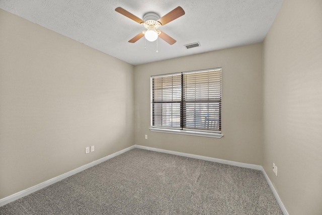 spare room with carpet flooring and ceiling fan